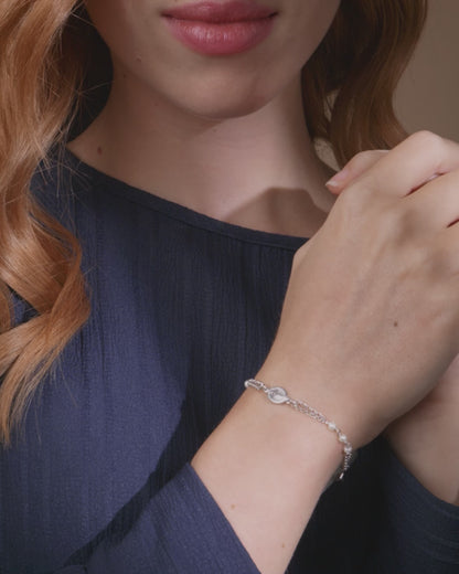 Sterling Silver Bracelet with White Beads Featuring the Miraculous Medal and a Cross